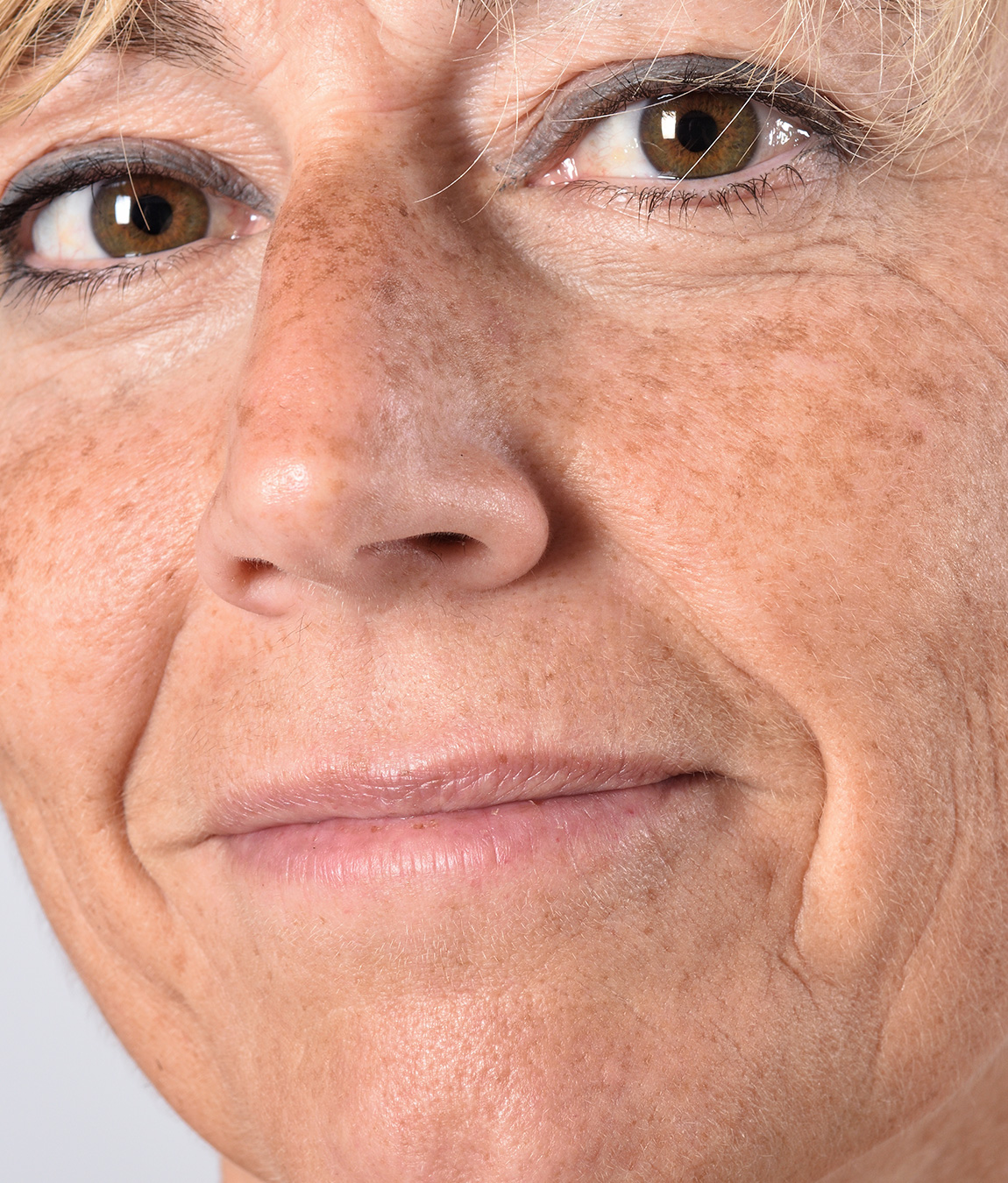 Close-up on a middle-age woman's face and skin
