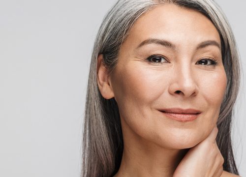 Happy woman after Kybella® treatments