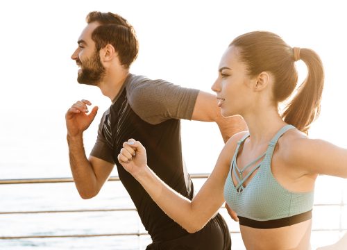 Man and woman jogging after medical weight loss treatments